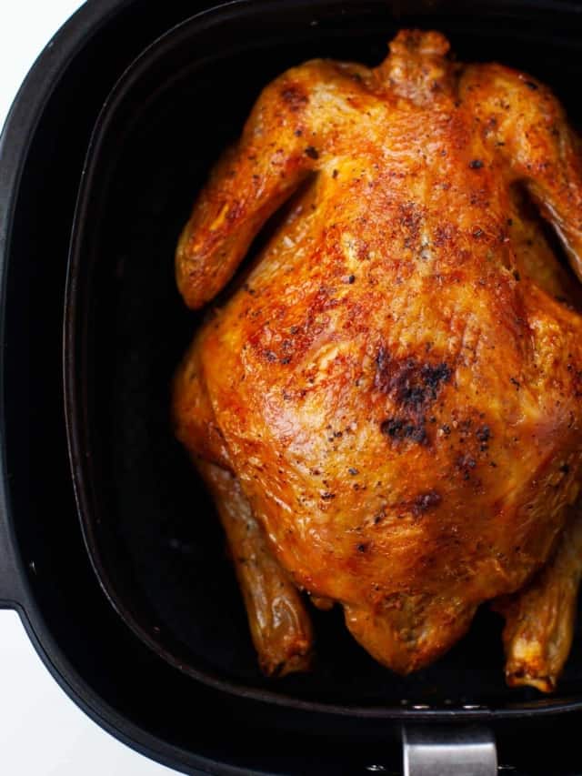 cooked whole chicken in air fryer basket 