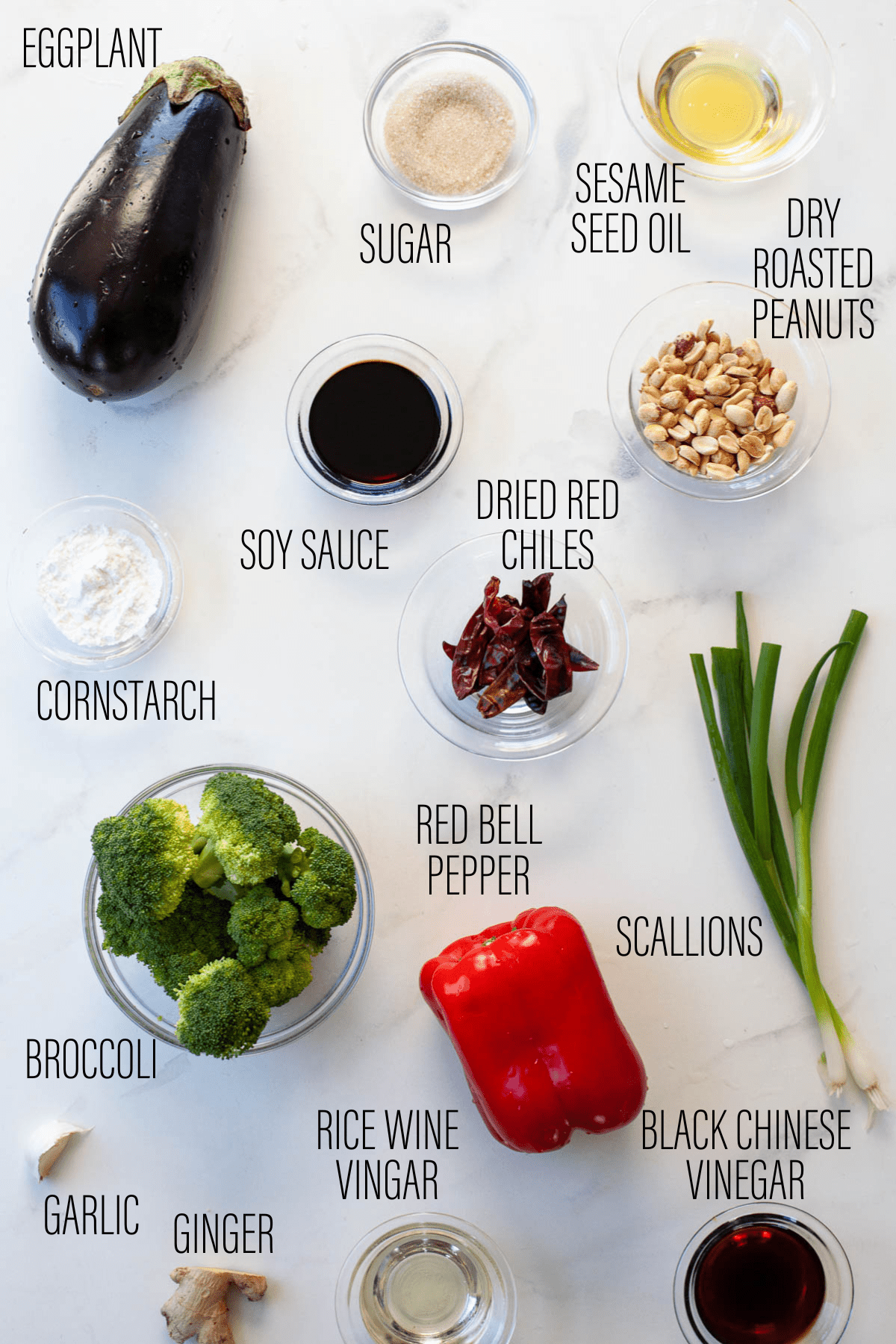ingredients for kung pao vegetables on white marble counter